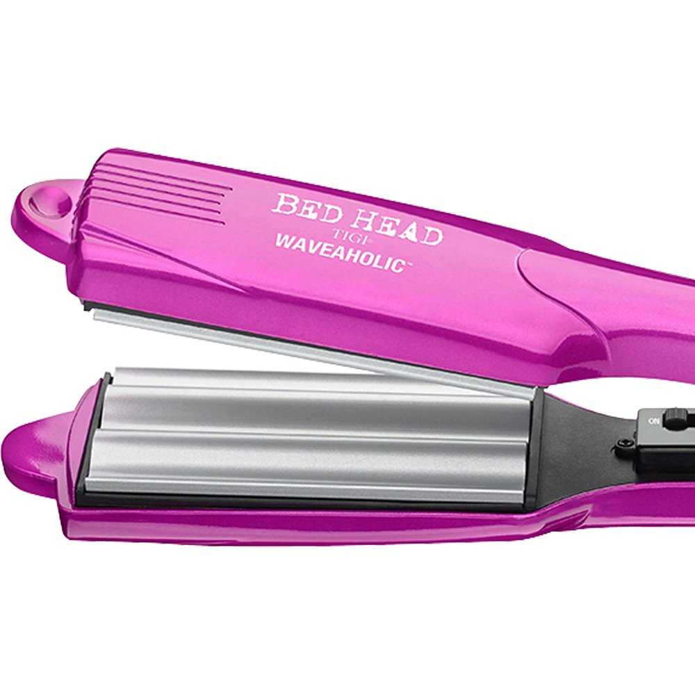 Close up view of the 2 inch tourmaline ceramic rippled plates on the Bed Head Waveaholic tool