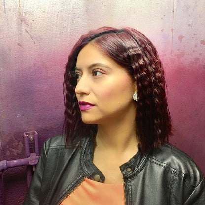 Angled view of the authentic Bed Head Waveaholic pink crimper for styling textured volume