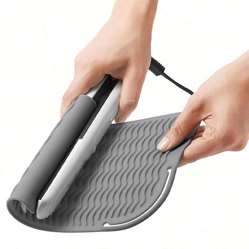 White silicone heat resistant pouch wrapped around a curling iron