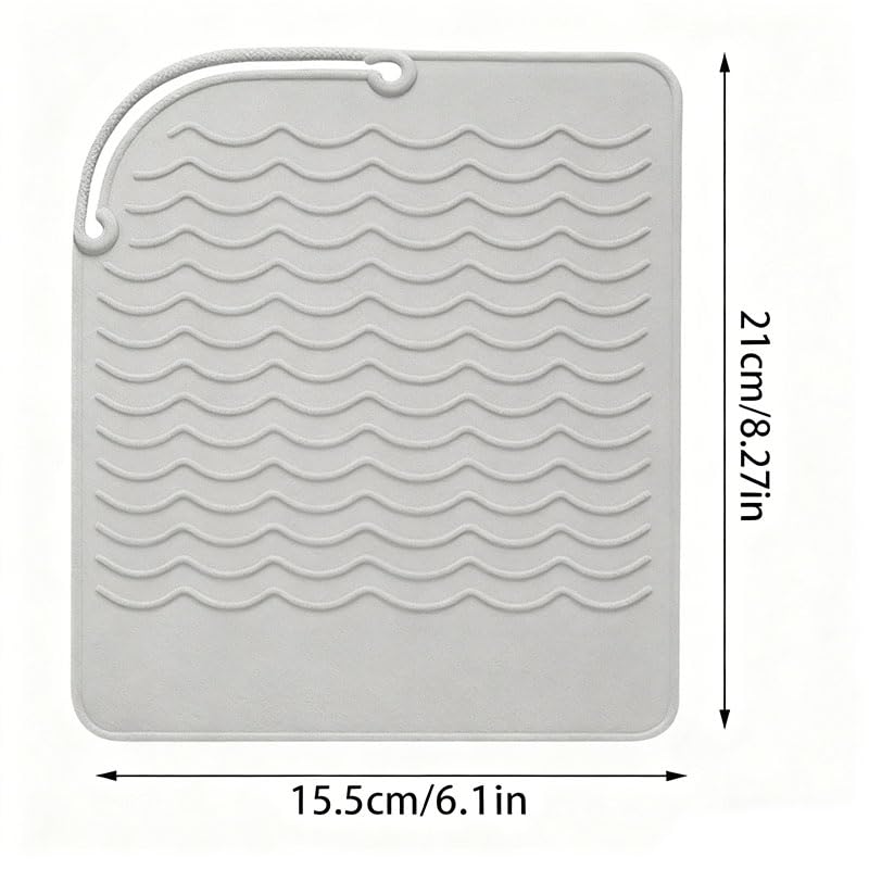 Heat proof styling station pad showcasing its universal compatibility with beauty tools
