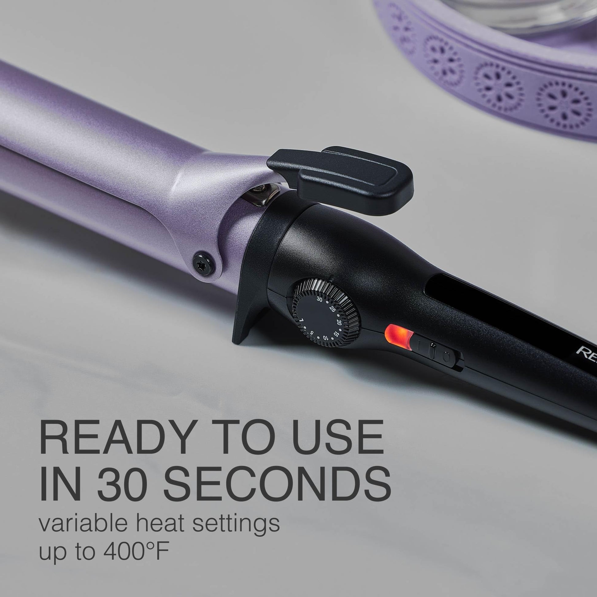 The ergonomic handle and LED readiness indicator light on the Remington professional salon curling iron.