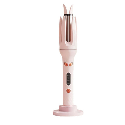 INK-EEZE automatic rotating curling iron showing the inner ceramic core and heating zone