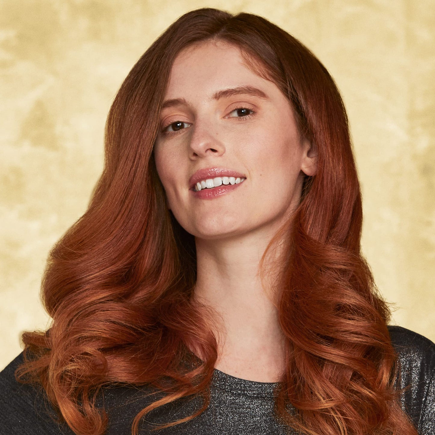 Hot Tools professional salon curling wand iron being adjusted for different hair types.