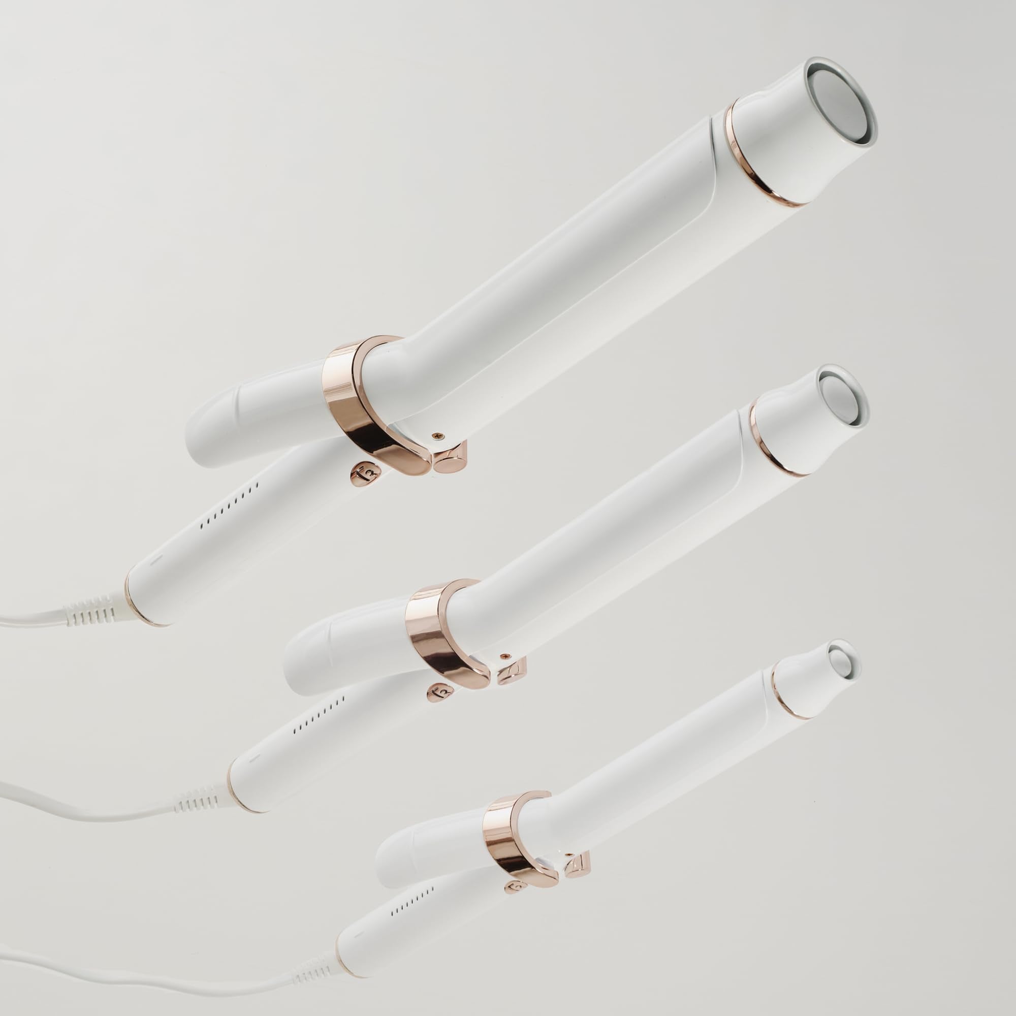 T3 long barrel curling wand resting on a flat surface demonstrating its professional design