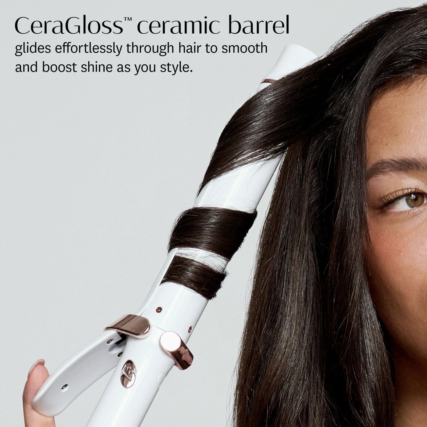 Premium T3 ceramic curling tool showcasing the sleek white body and clip mechanism