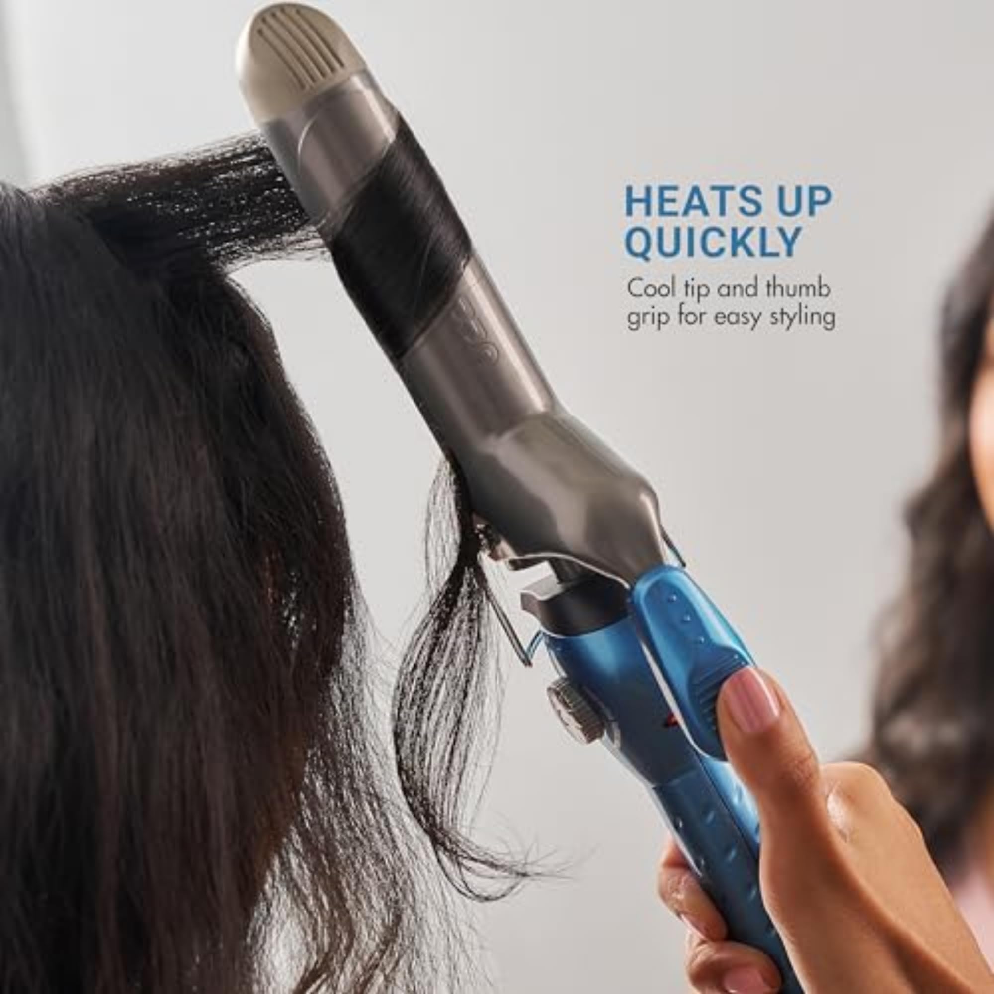 Authentic salon hair curler displaying the turbo heat boost button and power switch layout