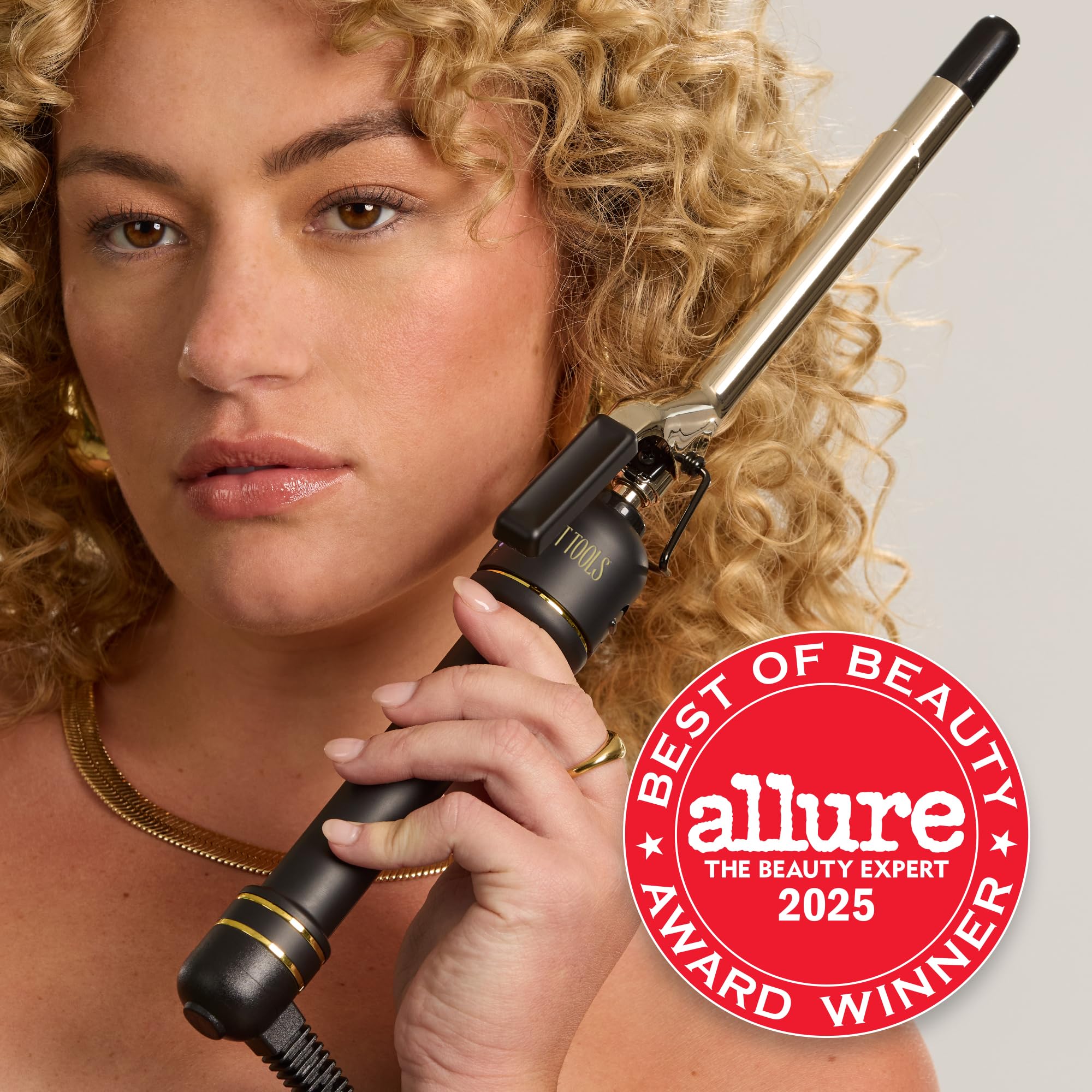 Hot Tools professional gold curling iron temperature dial and power button details.