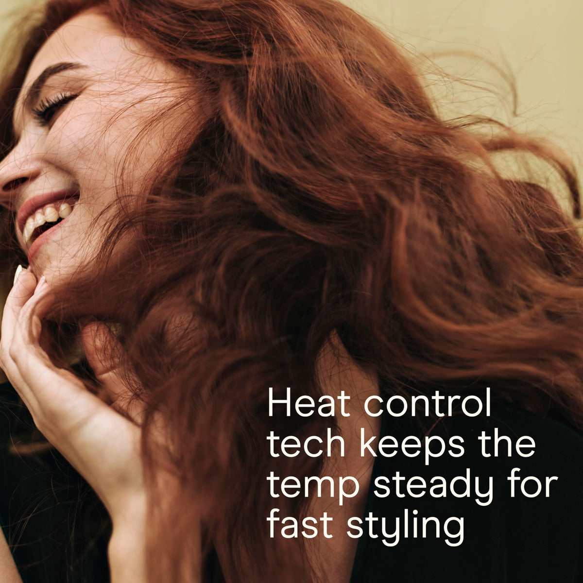 Hand holding Infinitipro by Conair curling wand showing ergonomic handle