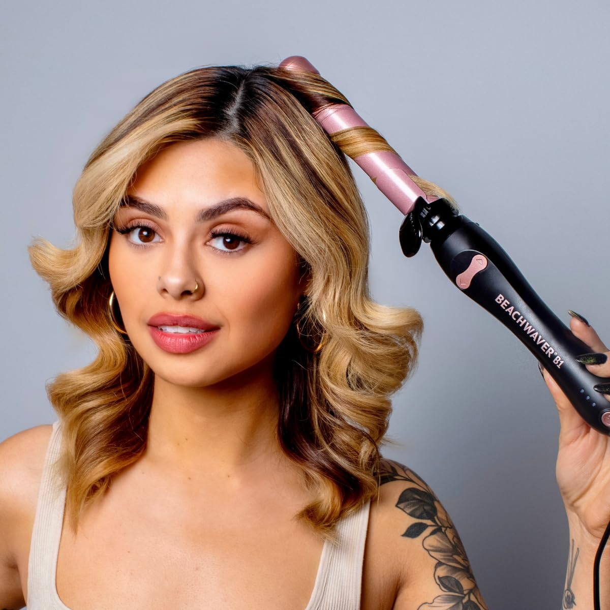 Beachwaver B1 rotating curling iron buttons and handle detail