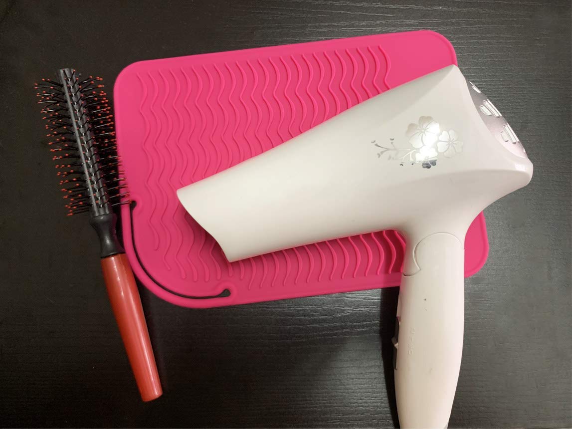 Portable pink heat resistant mat with styling tools for travel