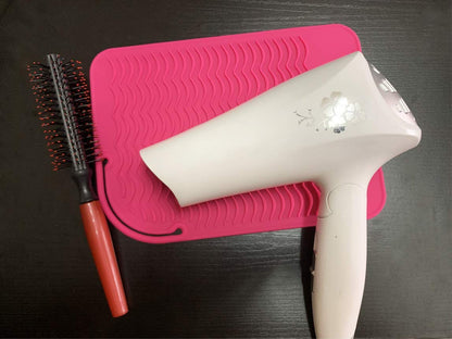 Portable pink heat resistant mat with styling tools for travel
