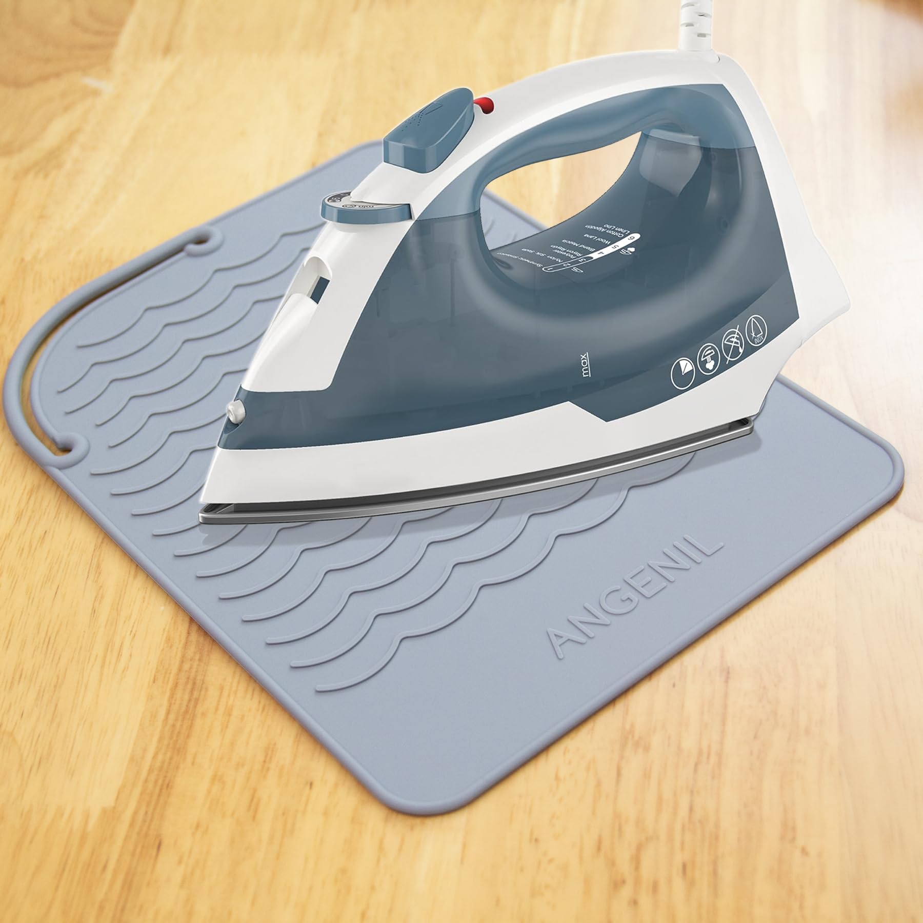 Angenil styling tool mat being used with a hair straightener