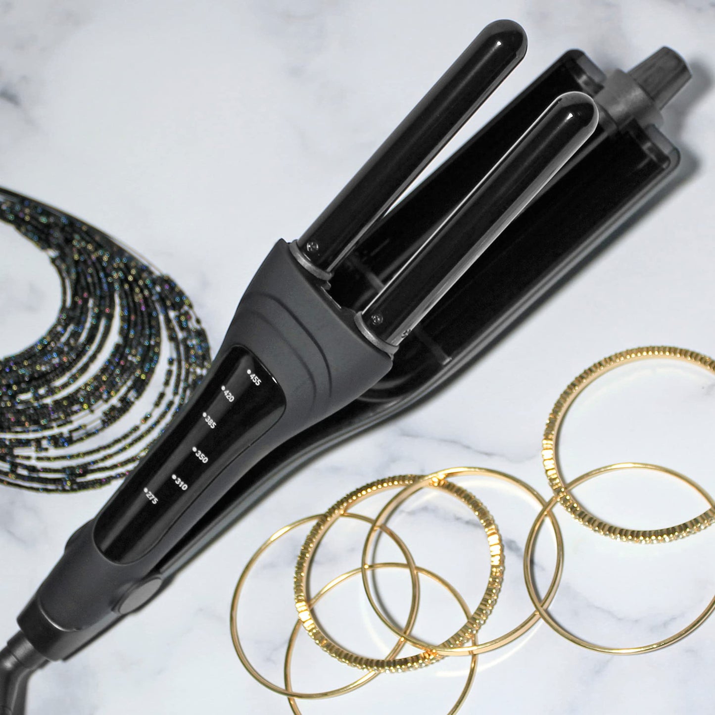 The complete packaging of the USA-imported Hot Tools Professional Black Gold Multi-Waver including the safety instruction manual.