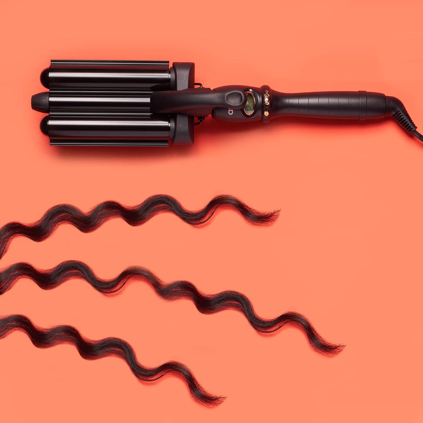 Amika professional beach waver tool resting securely on its built-in kickstand
