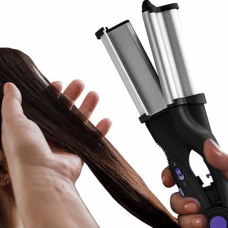 Hot Tools Pro Signature waver showcasing the ergonomic handle design and safety lock feature.