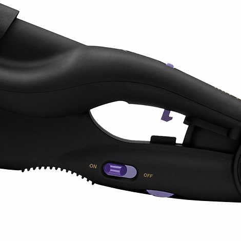 Angled perspective of the Hot Tools wave iron highlighting the deep barrel structure.