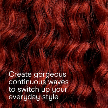 The ergonomic handle and turbo heat boost interface of the Conair rose gold curling wand.