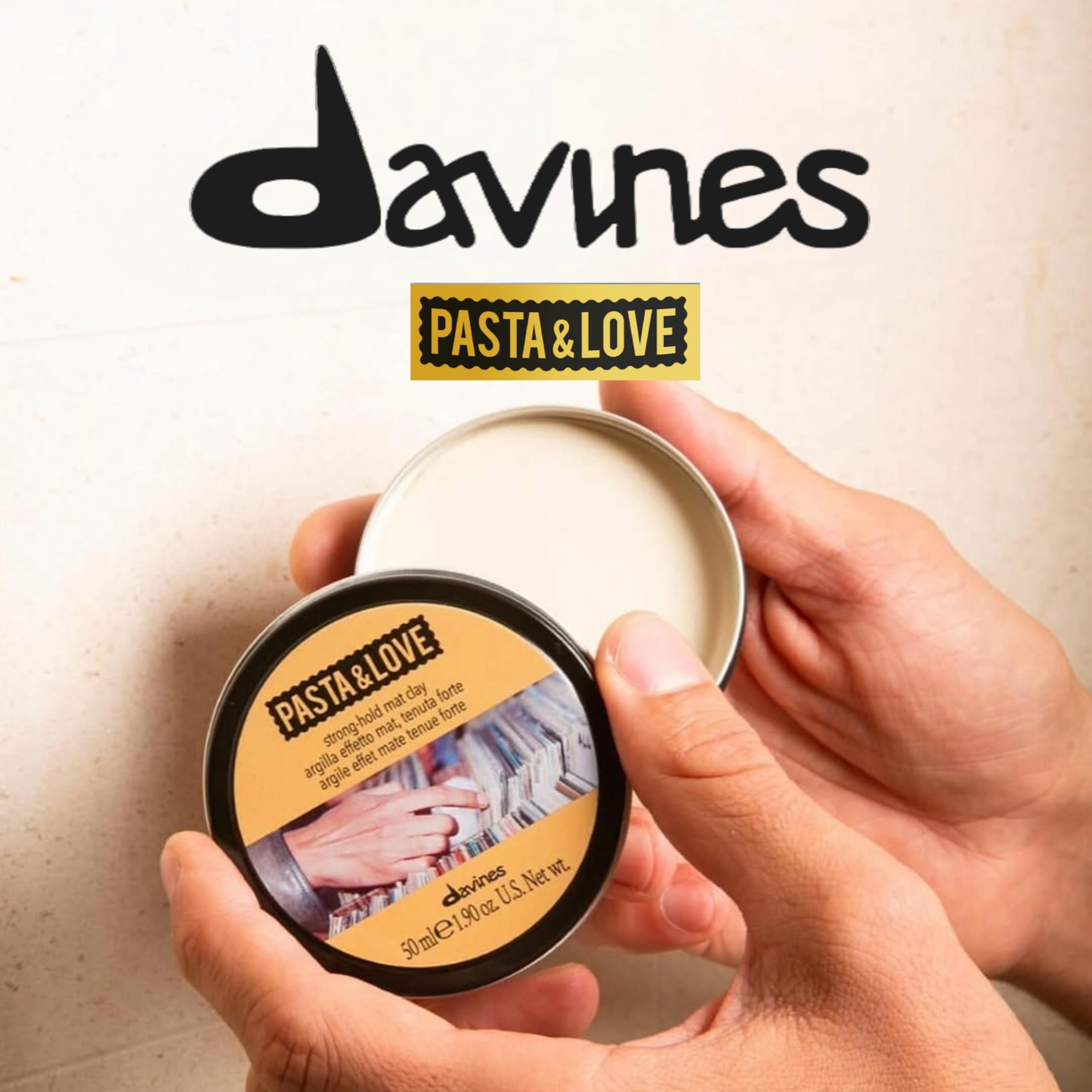 Davines Pasta and Love hair clay open tin showcasing the dry texture matte sculpting product