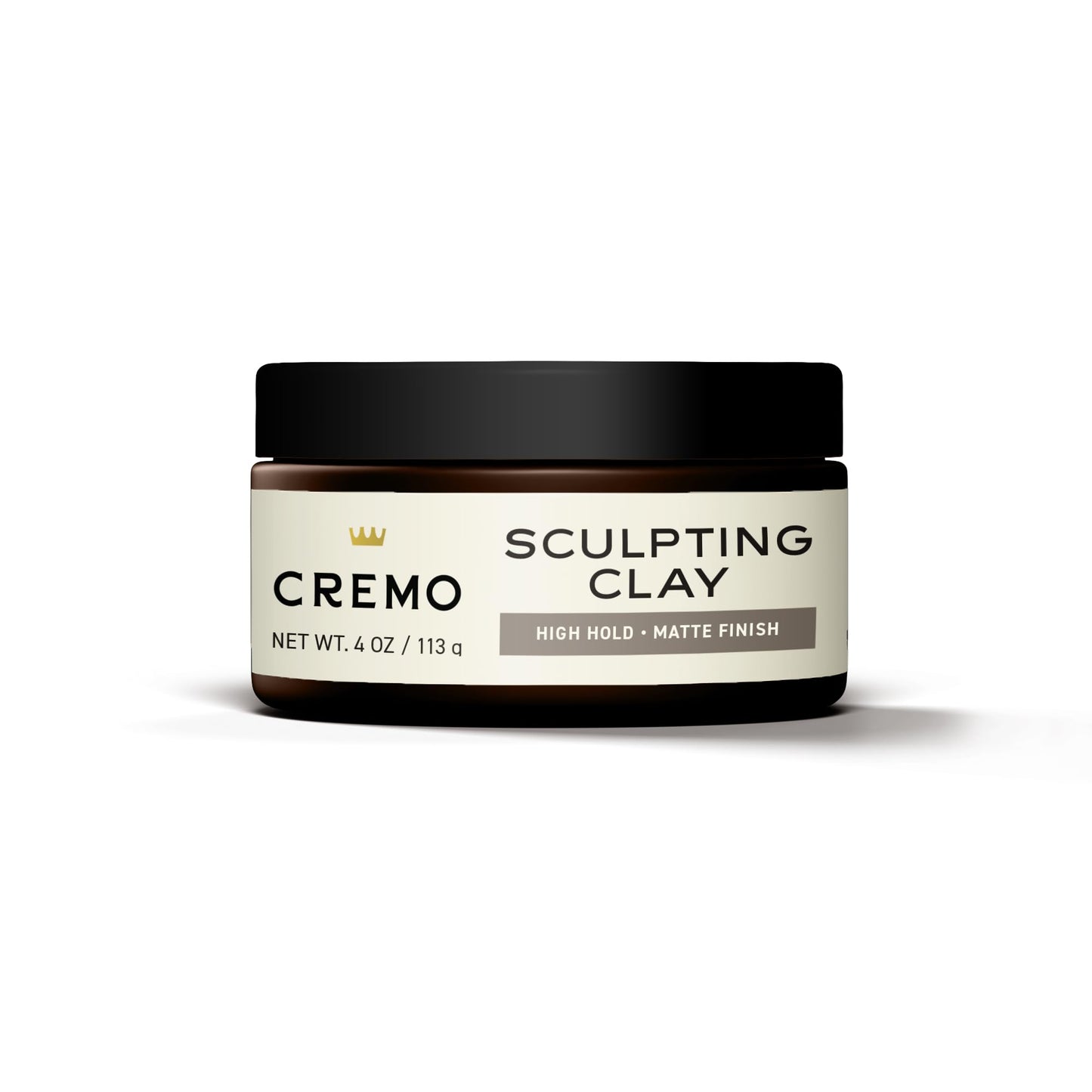 Cremo hair styling sculpting clay applied on hands for styling demonstration