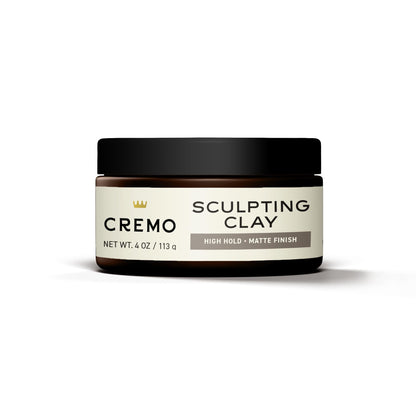 Cremo hair styling sculpting clay applied on hands for styling demonstration