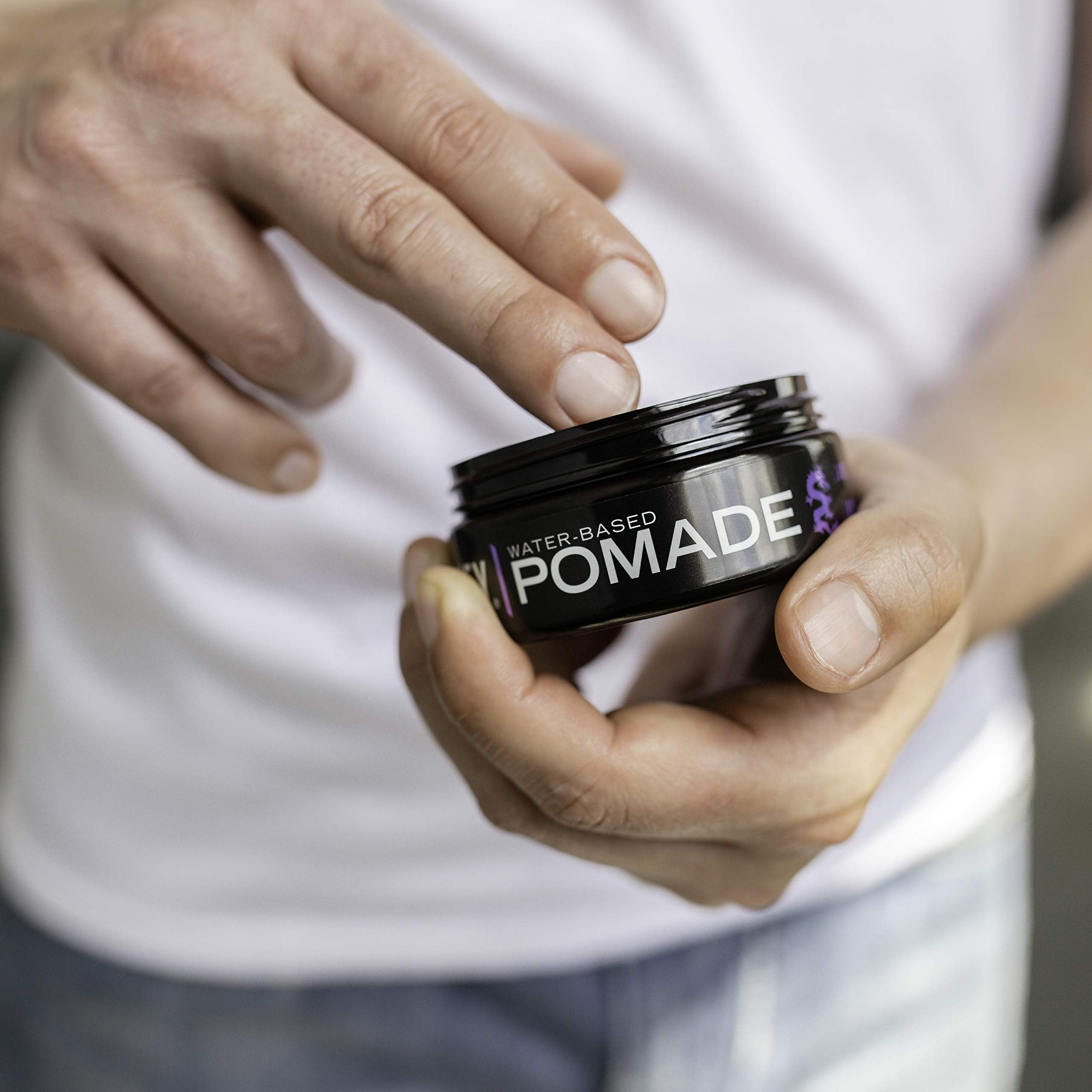 Billy Jealousy strong hold hair styling pomade container with open lid showcasing the thick gel texture.