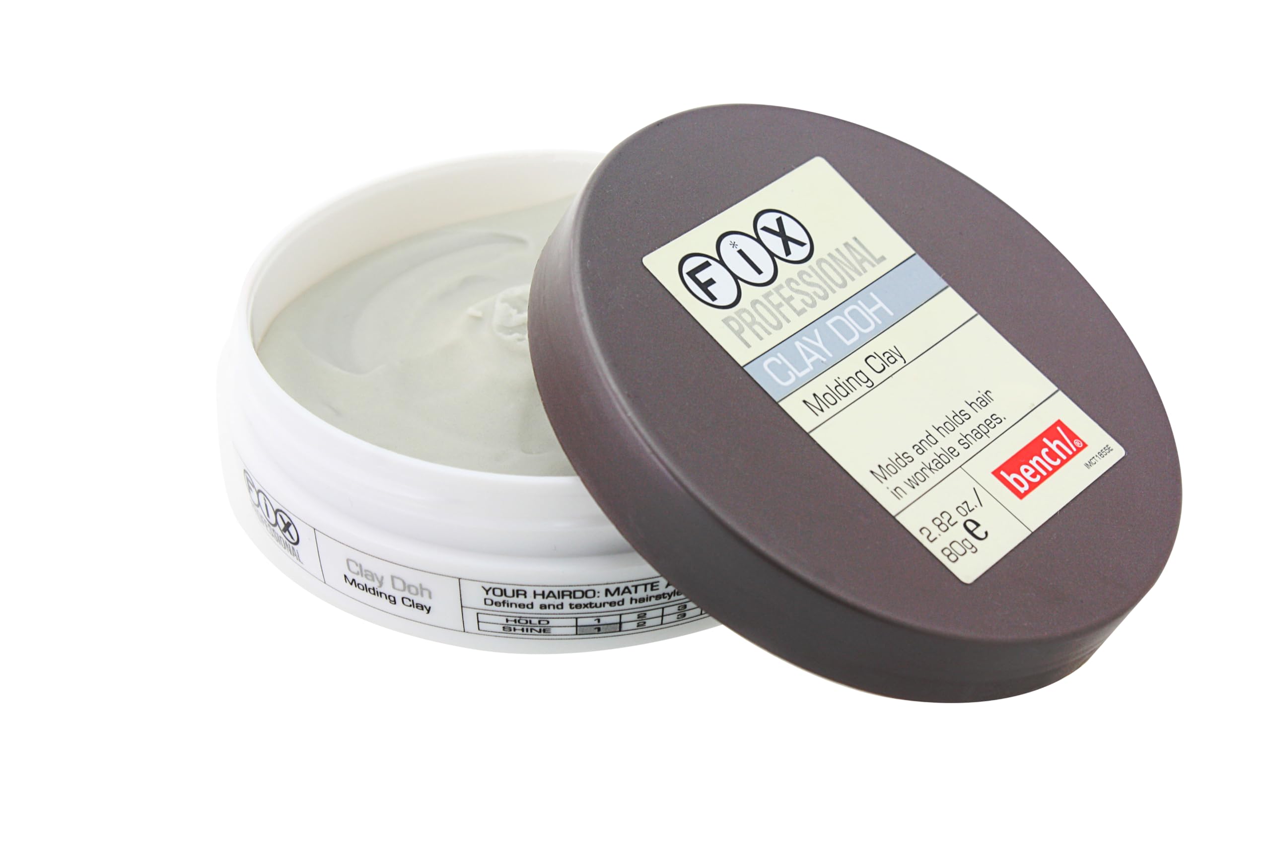 Open container of Bench Fix hair molding wax showing the smooth gray clay texture.