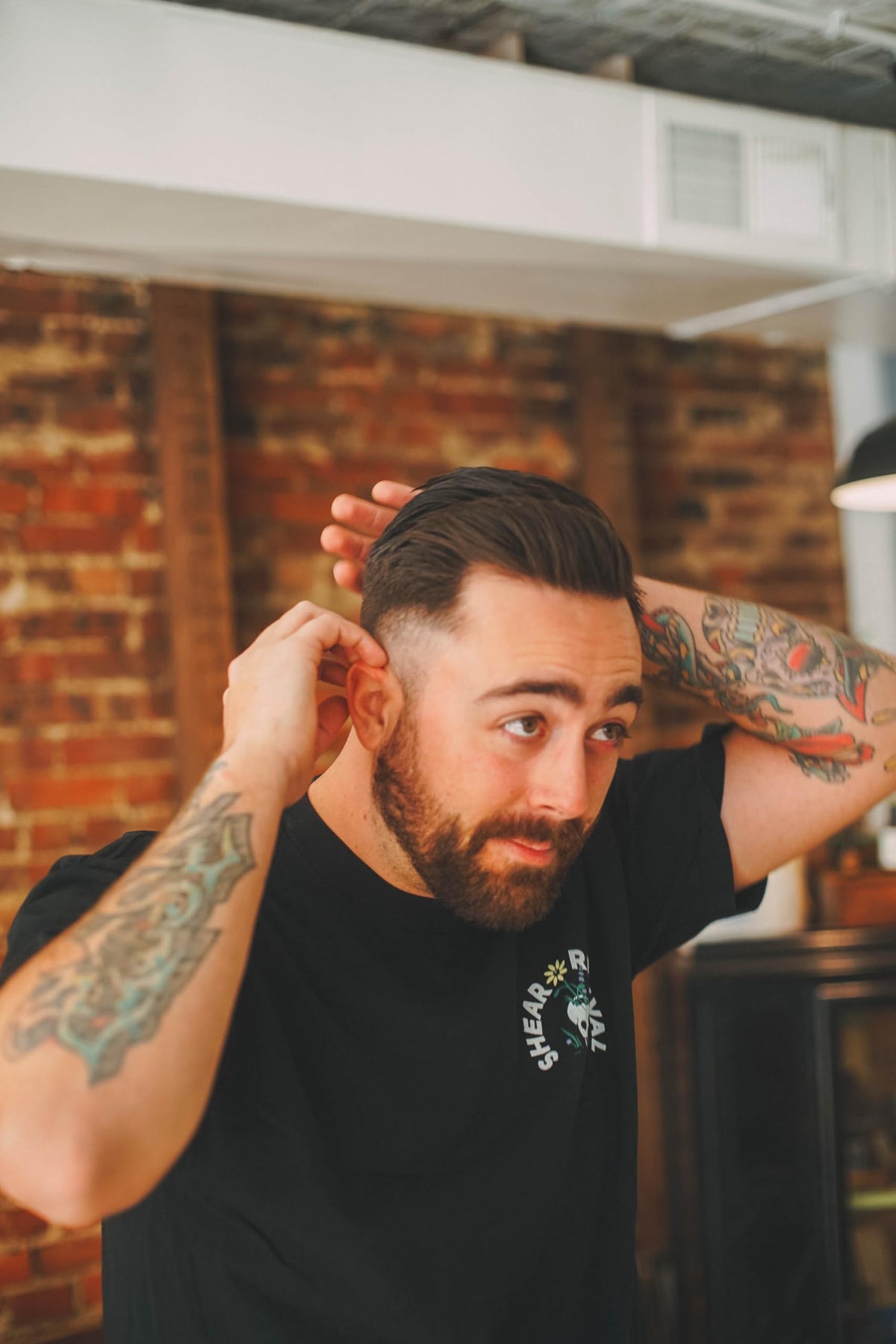 Shear Revival American Gardens clay pomade held in hand