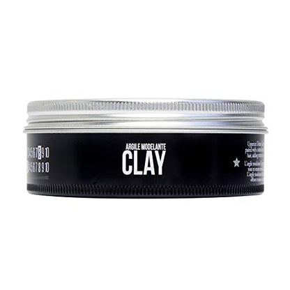 Open container of Uppercut Deluxe strong hold low shine styling clay.