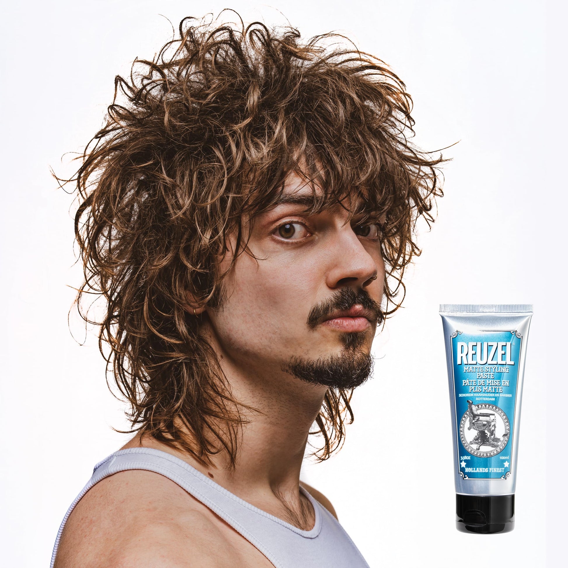 Reuzel matte texture paste tube opened to demonstrate the easy dispensing mechanism
