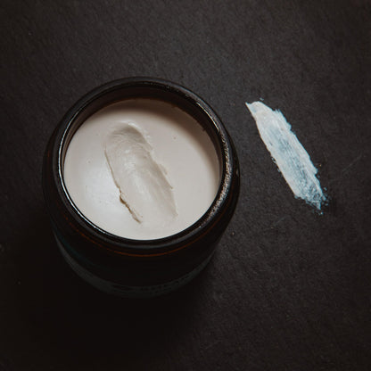 Shear Revival travel friendly hair paste container highlighting the citrus and sage scent formulation