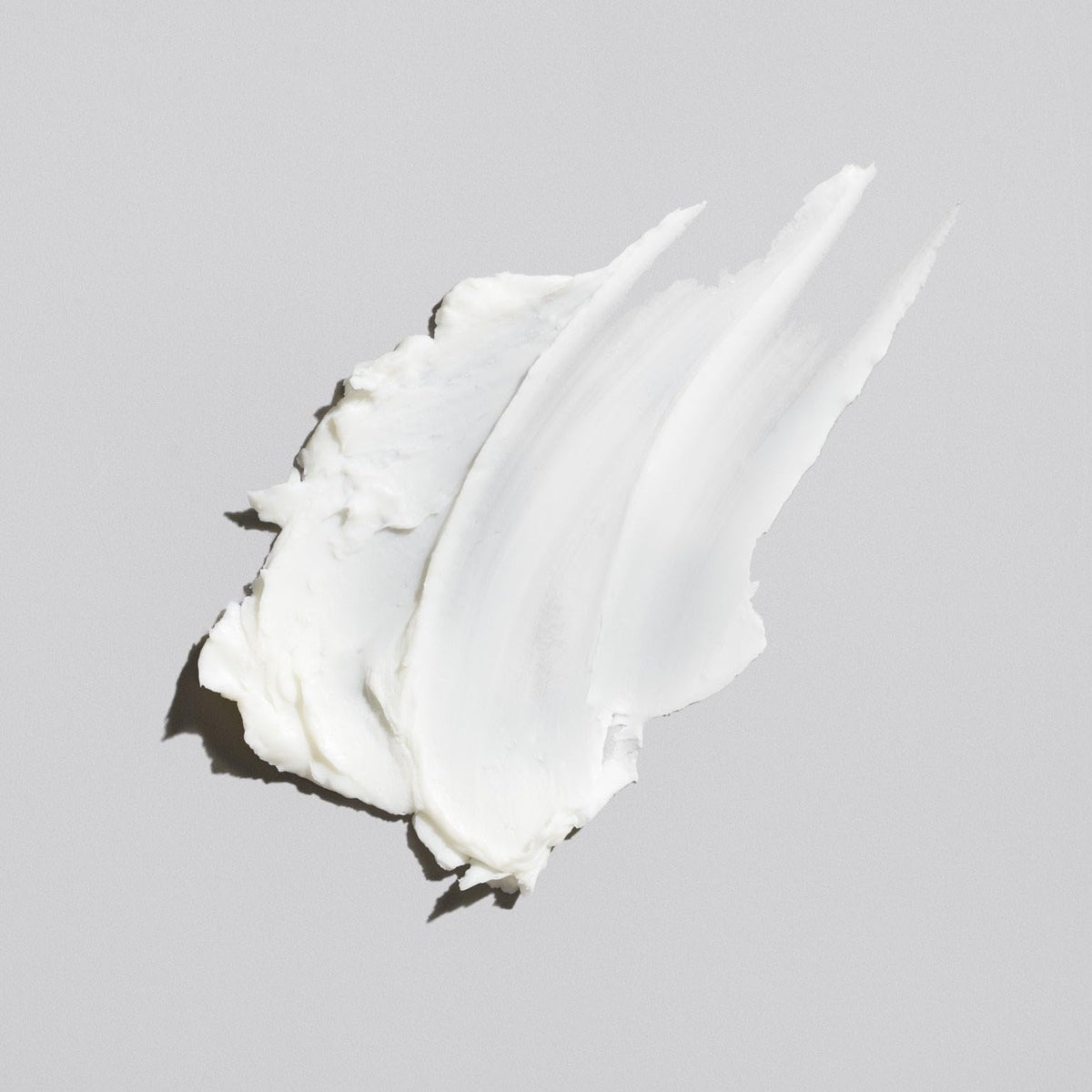 Flow Bros low shine hair clay jar featuring white silhouette logo
