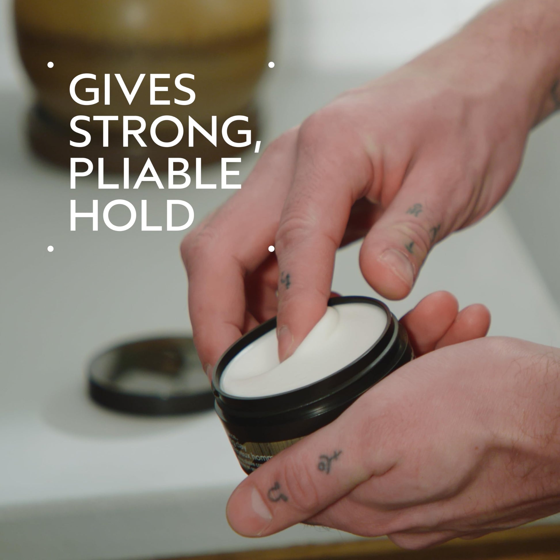 Aveda Men matte finish hair styling clay packaging showcasing 100 percent recycled plastic jar.