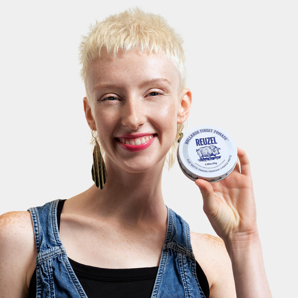 Reuzel professional grooming matte pomade presented in an authentic metallic container.