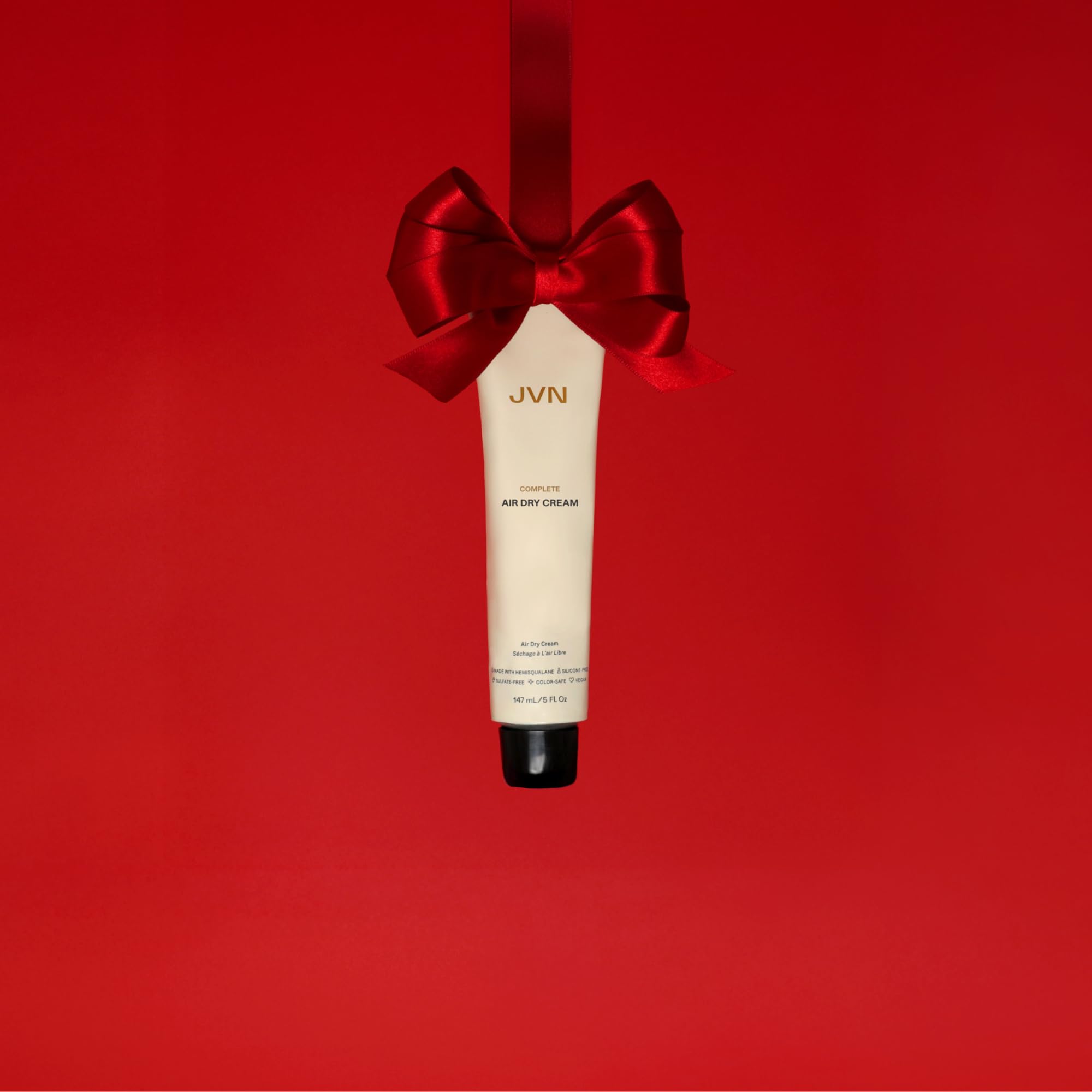 JVN hair smoothing cream texture squeezed out showing the lightweight styling formula.