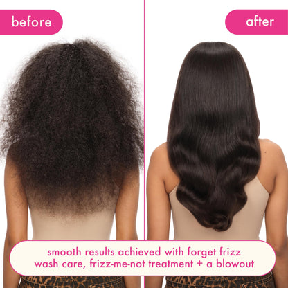 Amika Frizz Me Not leave in conditioner fluid ounce bottle placed upright against studio backdrop