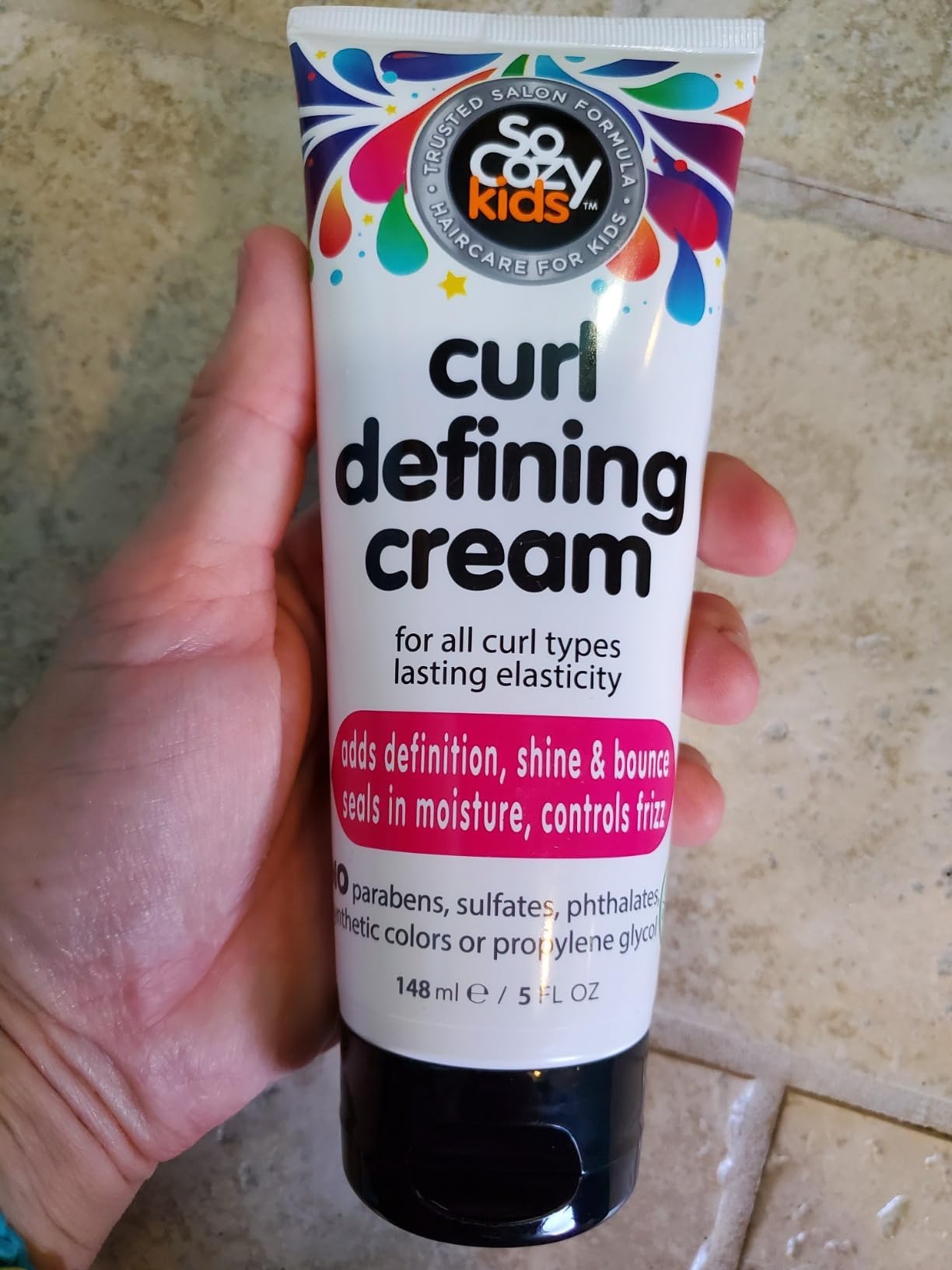 Texture shot of the lightweight non greasy socozy kids styling cream.