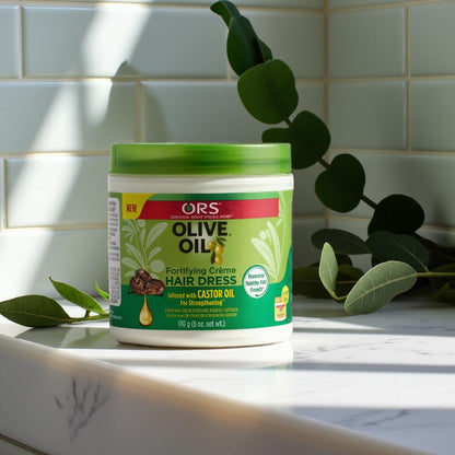 ORS Olive Oil Creme Hair Dress with Castor Oil showing product texture.