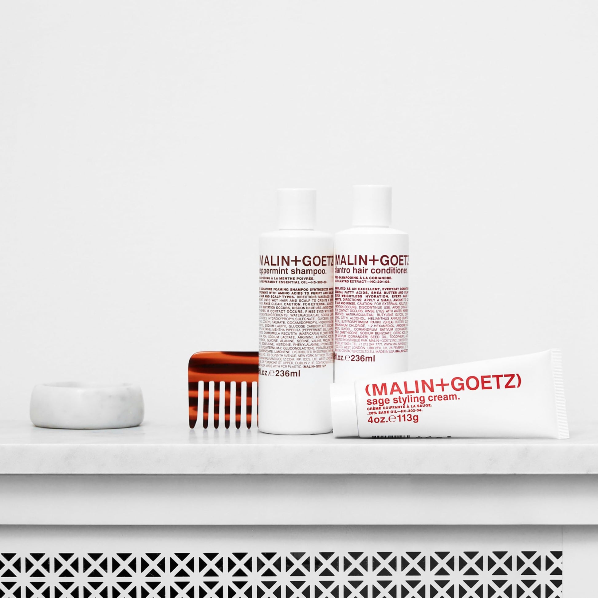 MALIN+GOETZ Sage Styling Cream texture shot of the nourishing hair cream