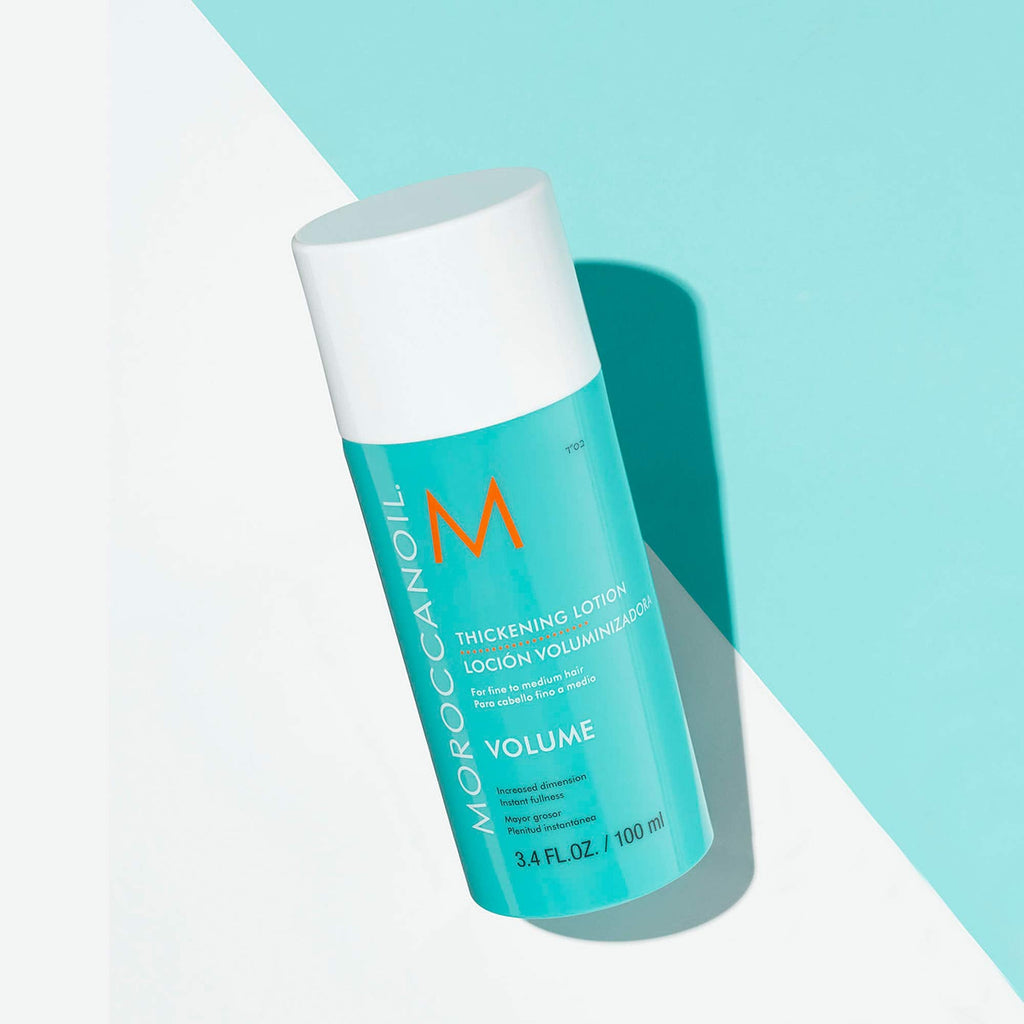Close up of the pump dispenser on the Moroccanoil hair thickening cream bottle.