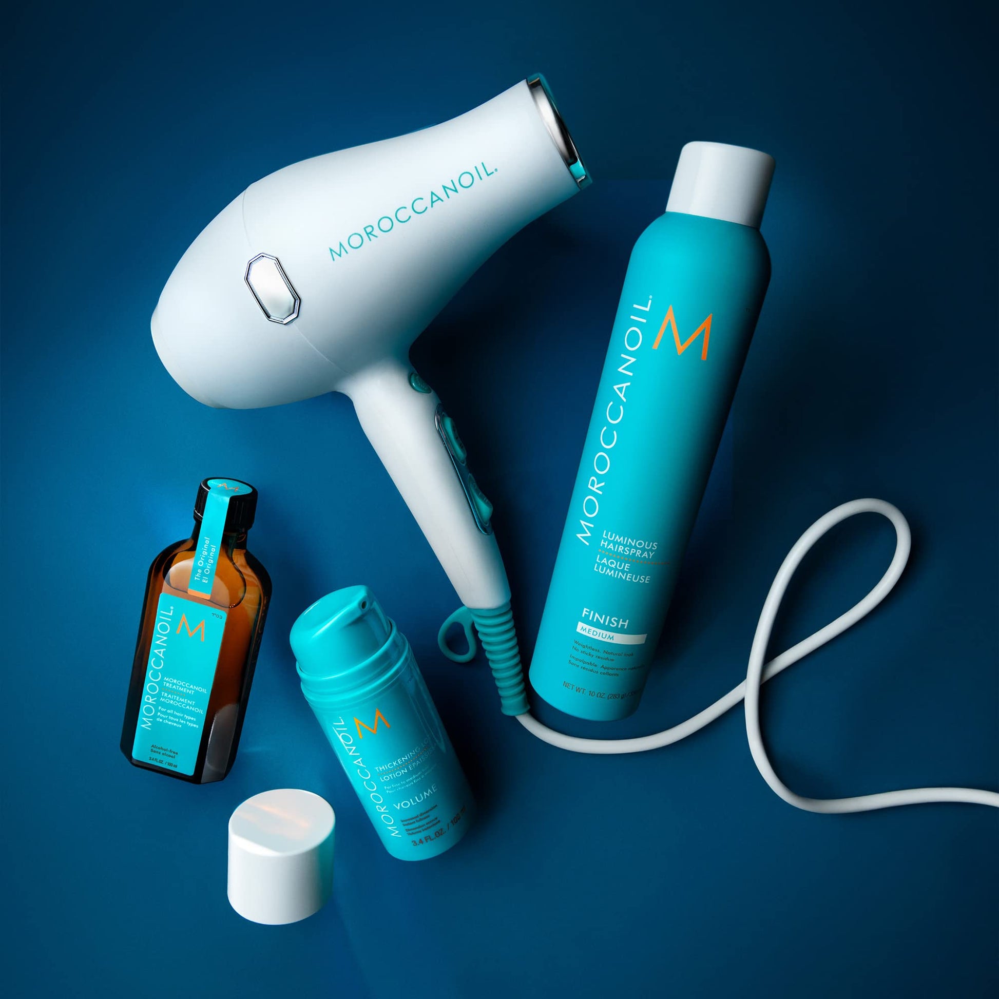 Side view of the authentic USA imported Moroccanoil styling lotion container.