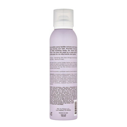 Hairitage texturizing hair spray bottle displaying ingredients list including rice protein and sunflower seed oil.