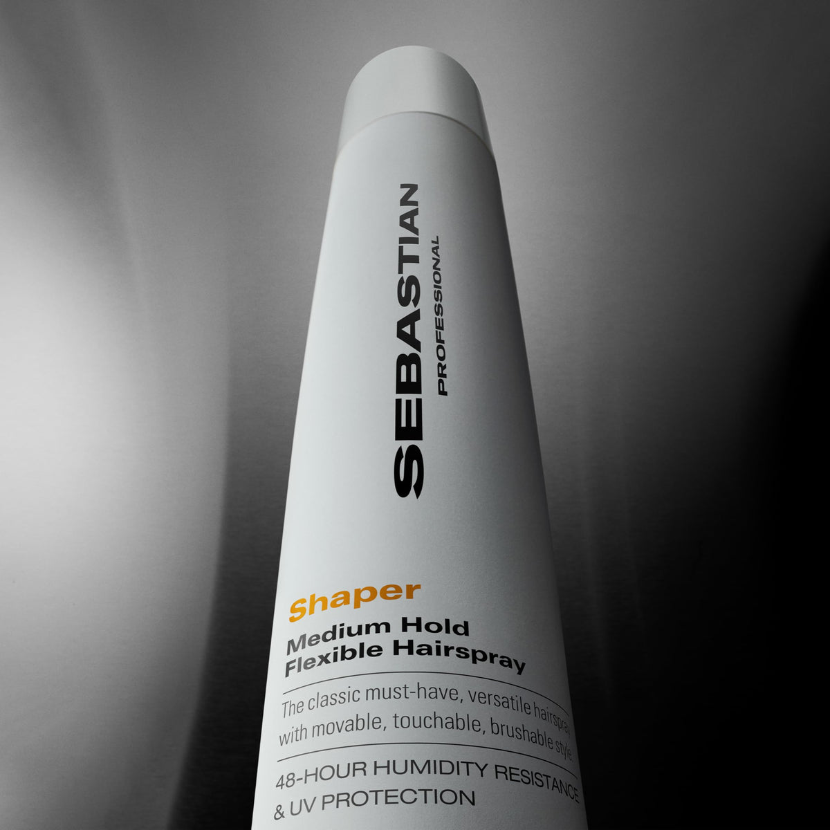 Full range view of Sebastian Professional hair styling spray bottle for frizz control