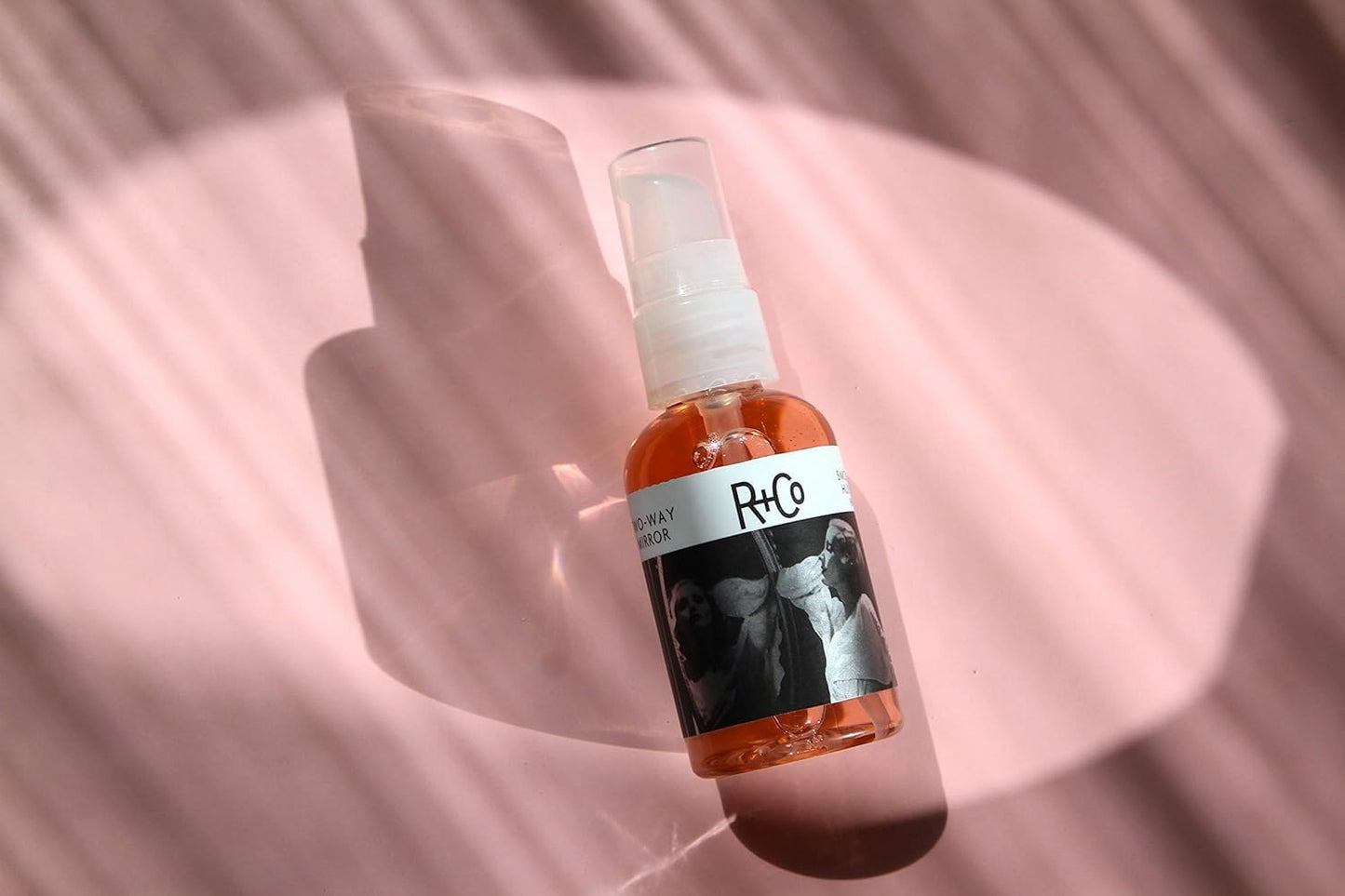 Luxury USA imported R+Co hair oil bottle texture and consistency
