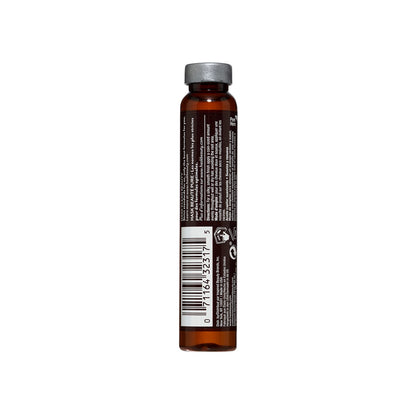 Close up of an individual eighteen milliliter glass vial of lightweight frizz control keratin hair treatment.