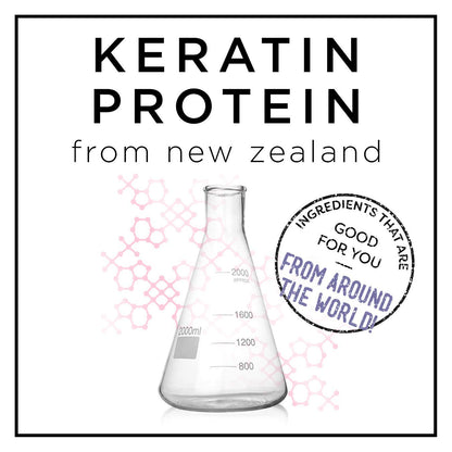 Textured shot of the clear non greasy smoothing hair oil being poured from the vial.