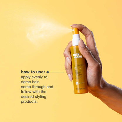 Milk_Shake illuminating hair oil packaging showing official ingredients and barcode.