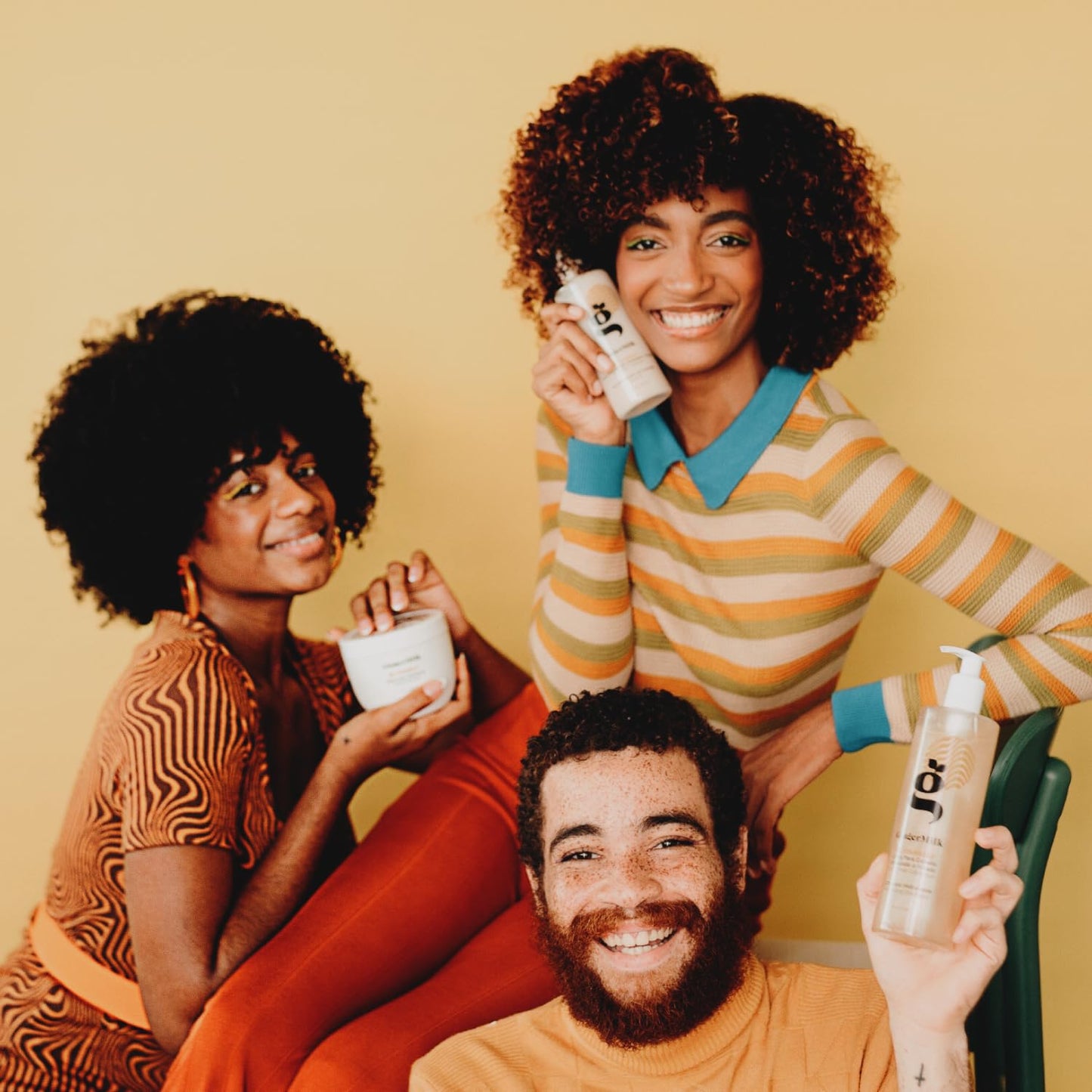 Ginger Milk Be Yourself oil being used to scrunch out the crunch on styled curls.