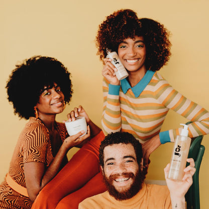 Ginger Milk Be Yourself oil being used to scrunch out the crunch on styled curls.