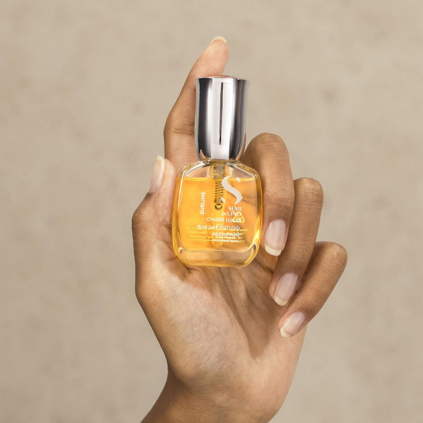 Side view of the premium smoothing heat protectant spray bottle emphasizing its compact travel-friendly dimensions.