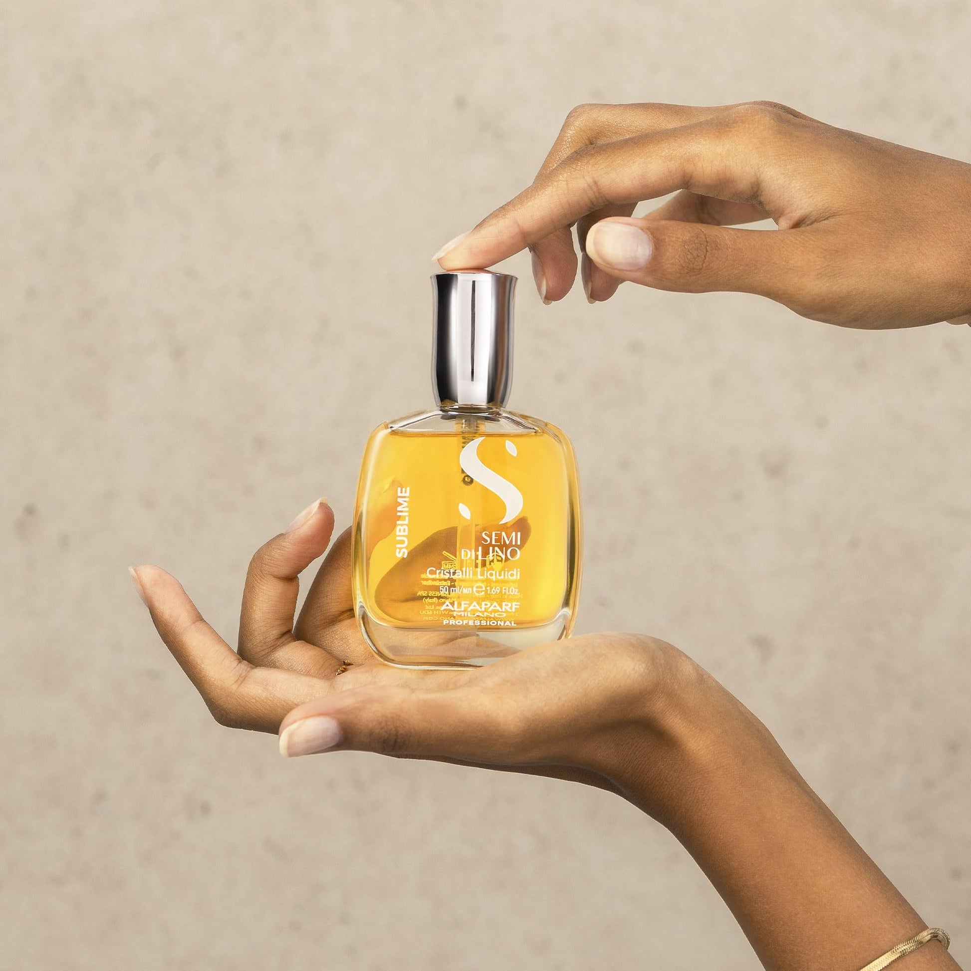 Alfaparf Milano Cristalli Liquidi 50ml bottle placed upright for anti frizz hair care.